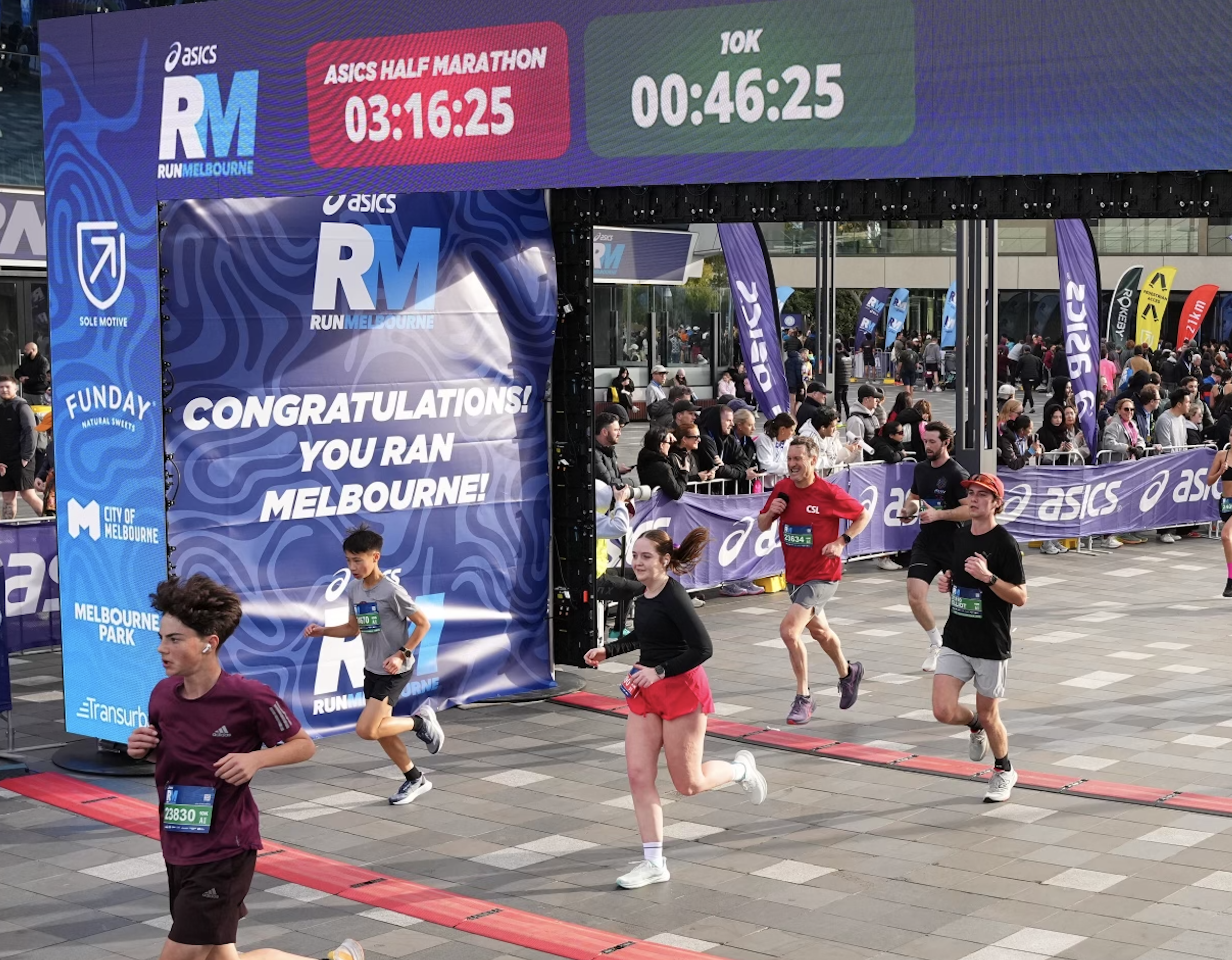 Mikaela at the half marathon finish line